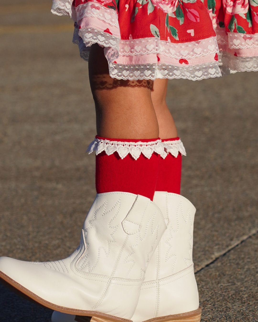 Red knee highs with white heart trim