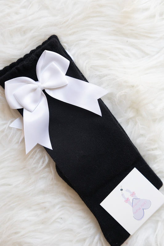 Black knee highs with white bows